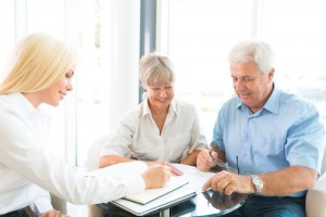 Elderly couple purchasing life insurance